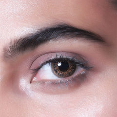 a close up of a person wearing a pair of scissors