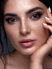 a close up of a person talking on a cell phone