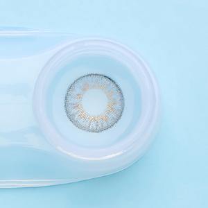 a close up of a blue and white frisbee on a white surface