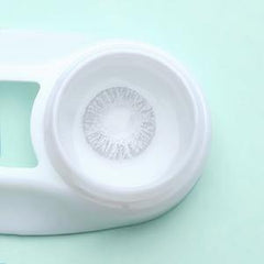 a close up of a white frisbee on a table