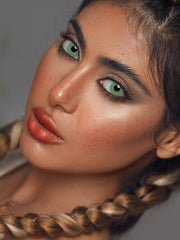 a close up of a child holding a spoon