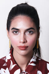 a woman is smiling and holding a cell phone