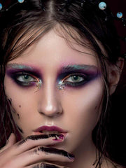 a close up of a girl brushing her teeth 