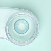 a close up of a toothbrush in a glass cup