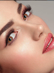 a man is brushing his teeth with a pink toothbrush