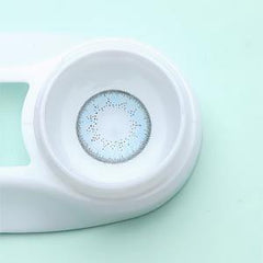 a close up of a frisbee on a white surface