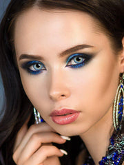 a close up of a woman brushing her teeth