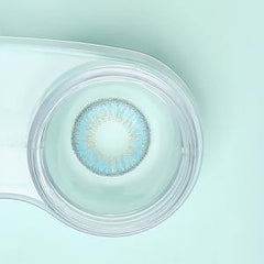 a close up of a toothbrush in a glass cup