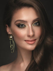 a woman is smiling and smiling for the camera